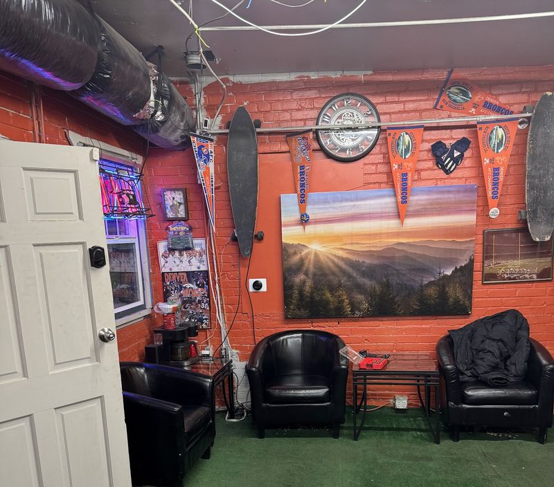 Chairs and Denver sports decorations in the shared location's waiting area